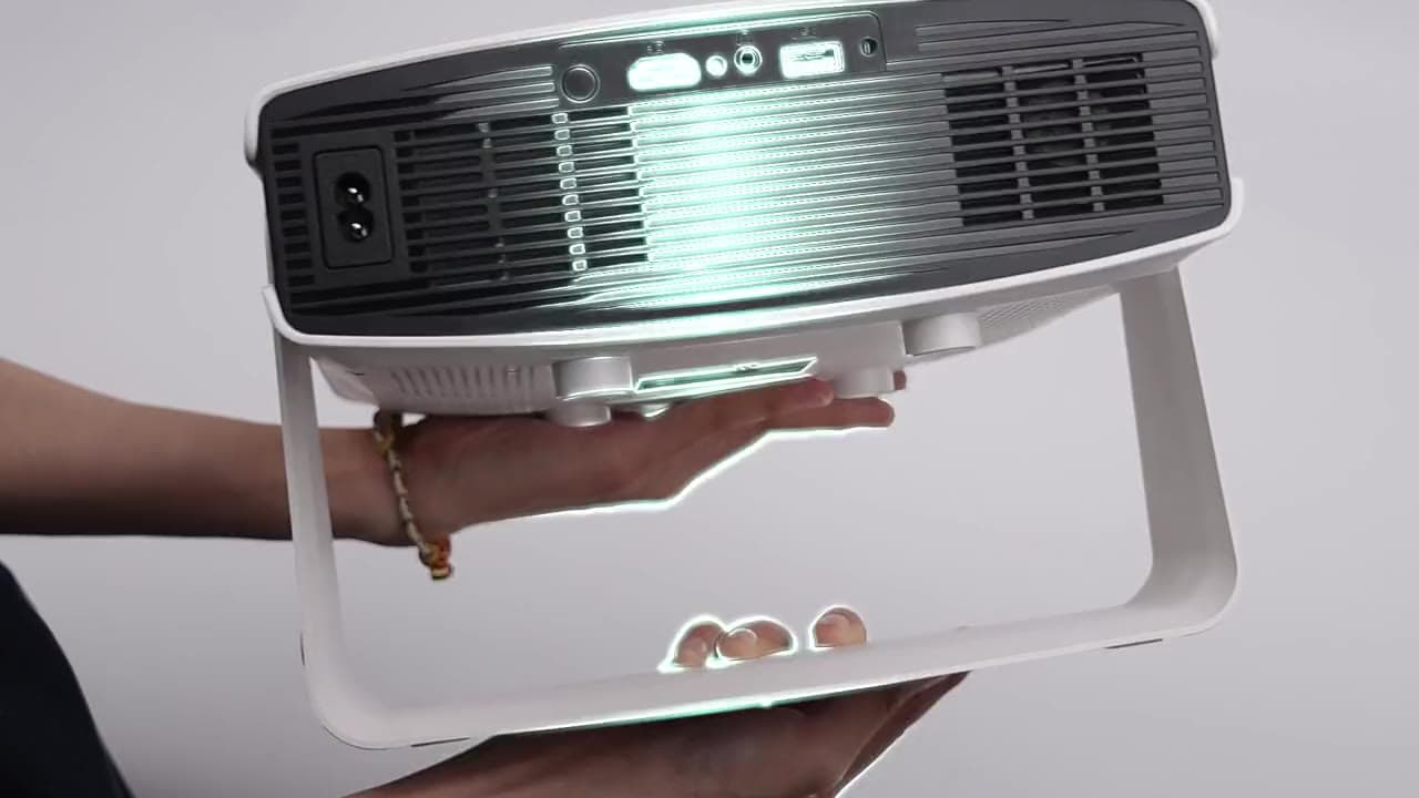 BluNeuron IRIZ held in one hand, turning to show the rear ports before the camera pushes in on the lens